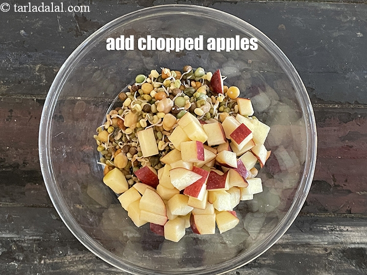 Step 19 – Add 3/4 cup&nbsp;<a href="https://www.tarladalal.com/glossary-chopped-apple-56i">chopped apple</a>.