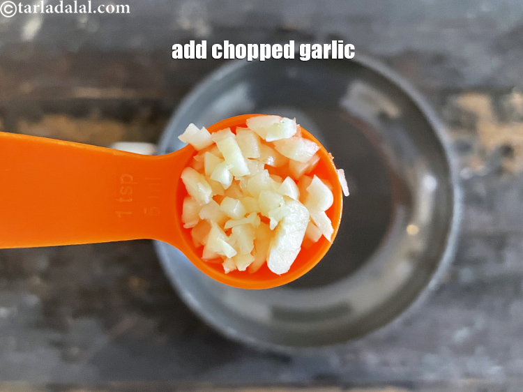 Step 4 – <meta charset="UTF-8" />Add 2 tsp&nbsp;finely&nbsp;<a href="glossary-chopped-garlic-790i">chopped garlic (lehsun)</a>.