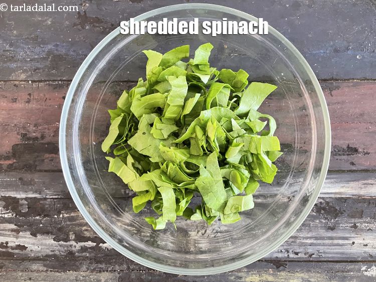 Step 17 – In a bowl put&nbsp;<meta charset="UTF-8" />1 cup&nbsp;<a href="glossary-shredded-spinach-777i">shredded spinach (palak)</a>.