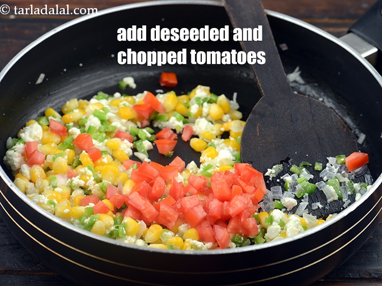 Step 10 – Add 1/4 cup&nbsp;deseeded and&nbsp;<a href="https://www.tarladalal.com/glossary-chopped-tomatoes-779i">chopped tomatoes</a>.&nbsp;