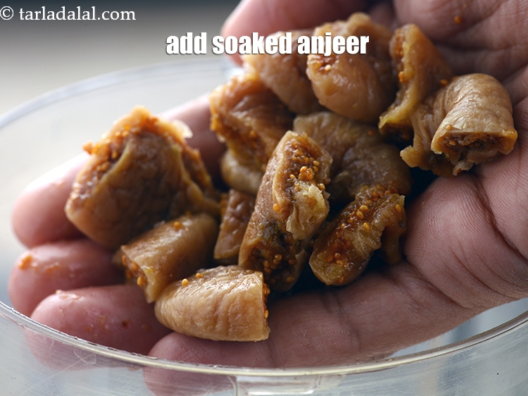 Step 10 – Add 8 soaked and chopped&nbsp;<a href="https://www.tarladalal.com/glossary-dried-figs-sukhe-anjeer-dry-anjeer-413i">dried figs (anjeer)</a>.