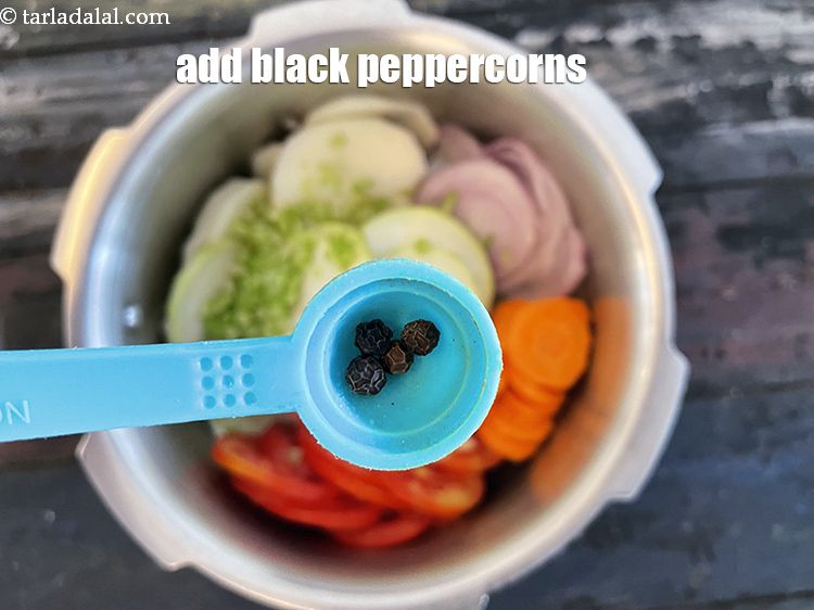 Step 10 – Add&nbsp;4&nbsp;whole&nbsp;<a href="glossary-black-peppercorns-kali-mirch-kalimirch-566i">black peppercorns (kalimirch)</a>.