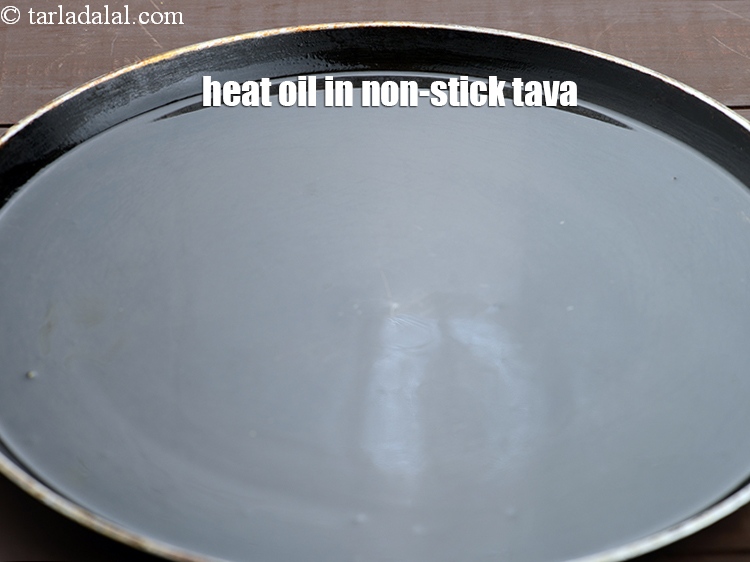 Step 10 – Heat 2 tbsp of oil in a non-stick tava (griddle).