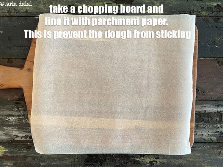 Step 10 – Take a chopping board and line it with parchment paper. This is to prevent the …