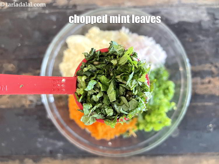 Step 15 – Add&nbsp;<meta charset="UTF-8" />1 tbsp&nbsp;<a href="glossary-chopped-mint-788i">chopped mint leaves (phudina)</a>.