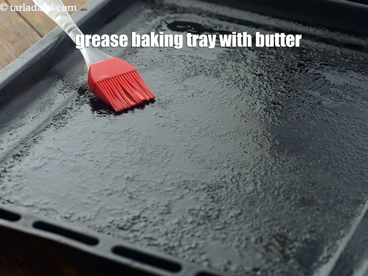 Step 10 – Grease a baking tray with butter.