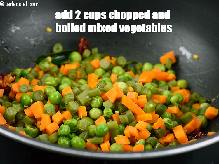 Step 29 – Add&nbsp;2 cups chopped and boiled mixed vegetables ( French beans, carrot and green peas).