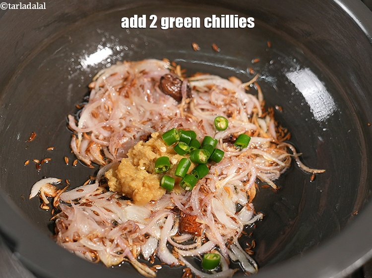 Step 11 – Add 2 <a href="https://www.tarladalal.com/glossary-chopped-green-chilli-820i">green chillies, chopped</a>.