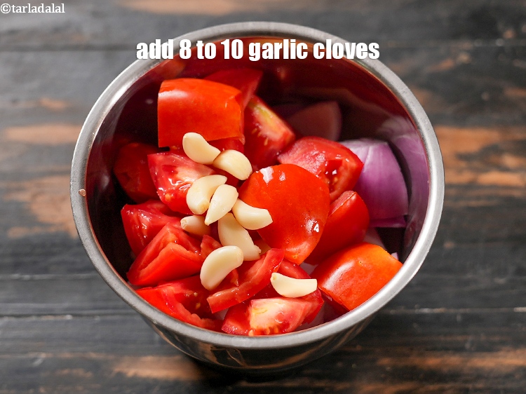 Step 11 – Add 8 to 10 <a href="https://www.tarladalal.com/glossary-garlic-cloves-1857i">garlic (lehsun) cloves</a>.&nbsp;
