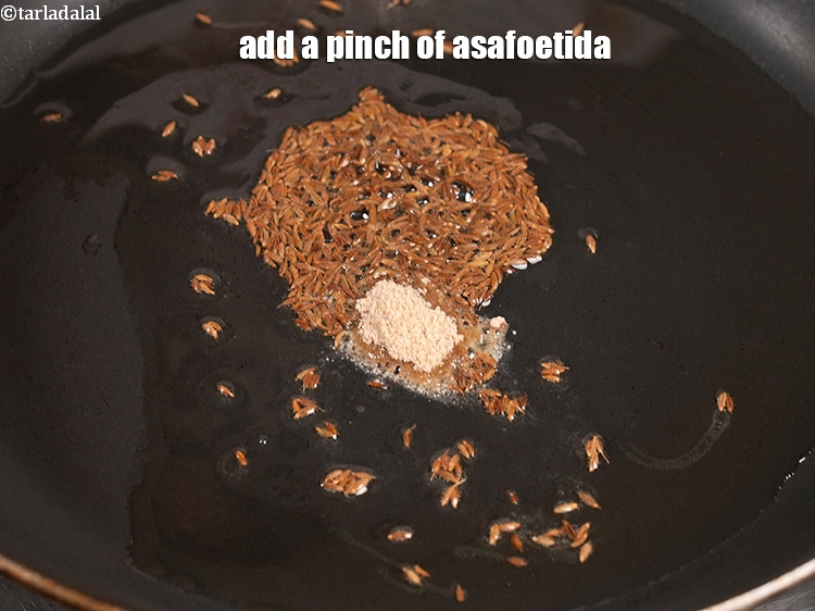 Step 11 – Add a pinch of asafoetida.