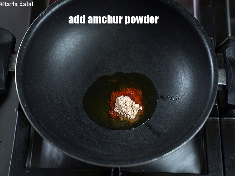 Step 11 – Add 1 tsp amchur powder.