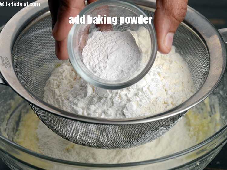Step 13 – Add 1 tsp <a href="https://www.tarladalal.com/glossary-baking-powder-425i">baking powder</a>.