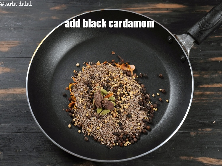 Step 11 – Add 2 <a href="https://www.tarladalal.com/glossary-black-cardamom-badi-elaichi-moti-elaichi-263i">black cardamom (badi elaichi)</a>.
