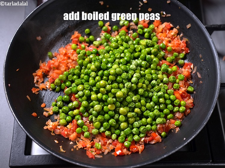 Step 11 – Add&nbsp;1 1/2 cups&nbsp;<a href="https://www.tarladalal.com/glossary-boiled-green-peas-1078i">boiled green peas</a>.