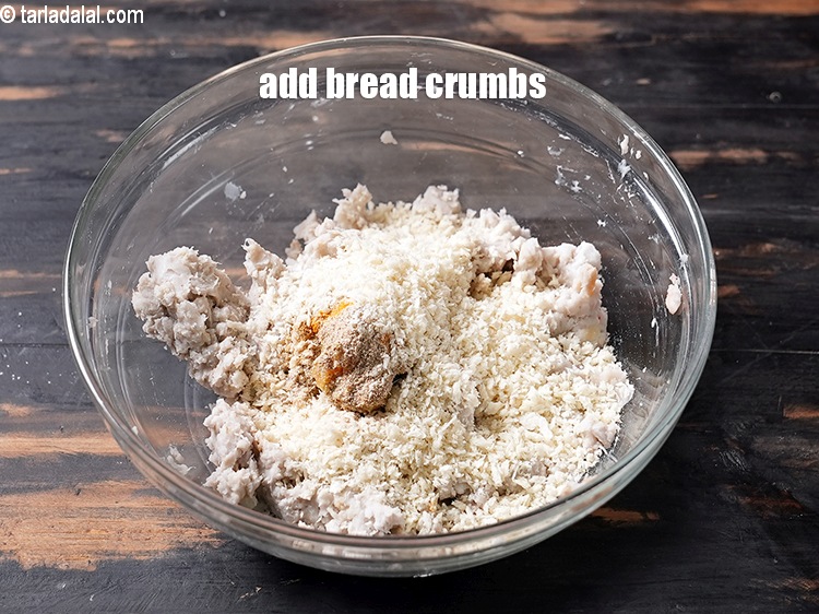 Step 11 – Add 1/4 cup <a href="https://www.tarladalal.com/glossary-bread-crumbs-breadcrumbs-222i">bread crumbs</a>.