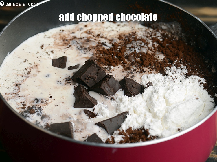 Step 11 – Add 1 cup <a href="https://www.tarladalal.com/glossary-chopped-dark-chocolate-792i">chopped dark chocolate</a>.