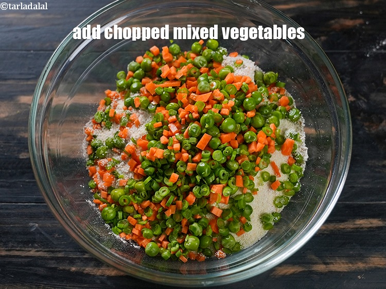 Step 11 – Add &frac34; cup <a href="https://www.tarladalal.com/glossary-chopped-mixed-vegetables-782i">chopped mixed vegetables</a> (carrot, French beans, green peas).
