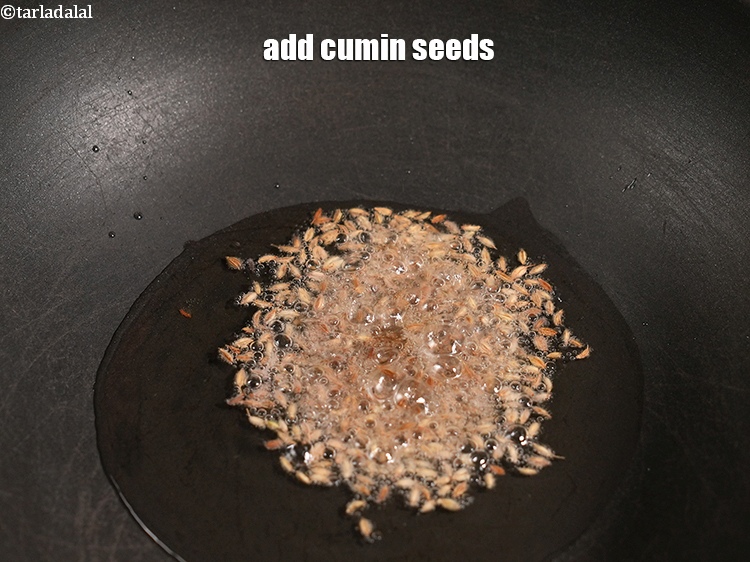Step 11 – Add 1 tsp <a href="https://www.tarladalal.com/glossary-cumin-seeds-jeera-zeera-381i">cumin seeds (jeera)</a>.&nbsp;