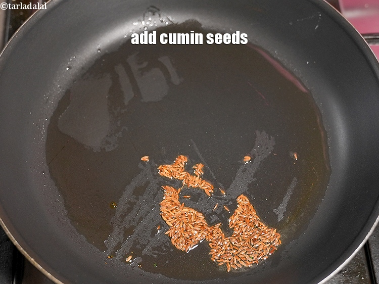 Step 11 – Add &frac12; tsp <a href="https://www.tarladalal.com/glossary-cumin-seeds-jeera-zeera-381i">cumin seeds (jeera)</a>.