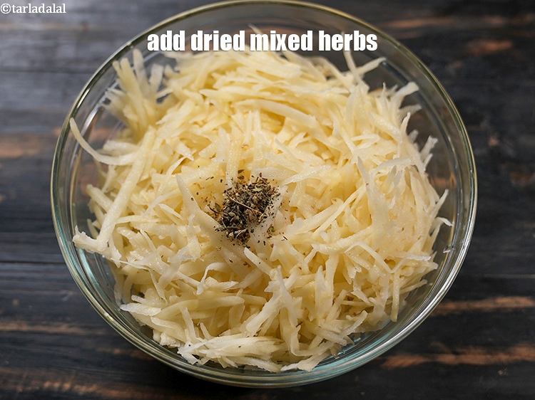 Step 11 – Add 1/2 tsp <a href="https://www.tarladalal.com/glossary-dried-mixed-herbs-466i">dried mixed herbs</a>.
