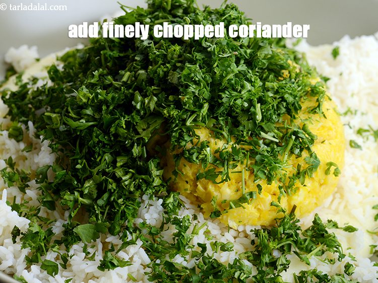 Step 11 – Add 1/2 cup finely <a href="https://www.tarladalal.com/glossary-chopped-coriander-783i">chopped coriander (dhania)</a>.