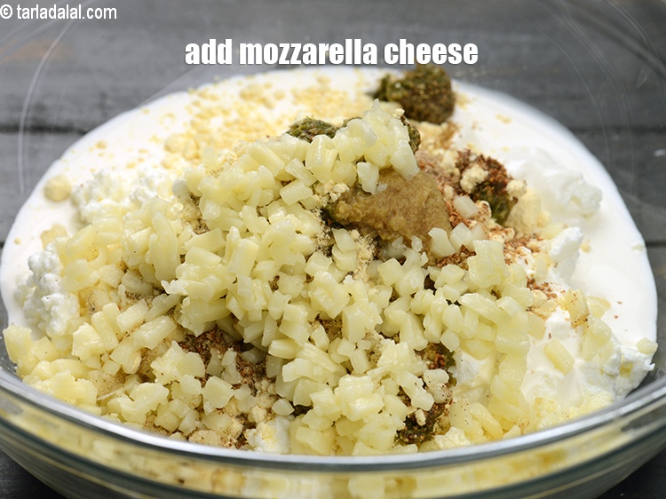 Step 11 – Add &frac14; cup <a href="https://www.tarladalal.com/glossary-diced-mozzarella-cheese-2805i">diced mozzarella cheese</a>.