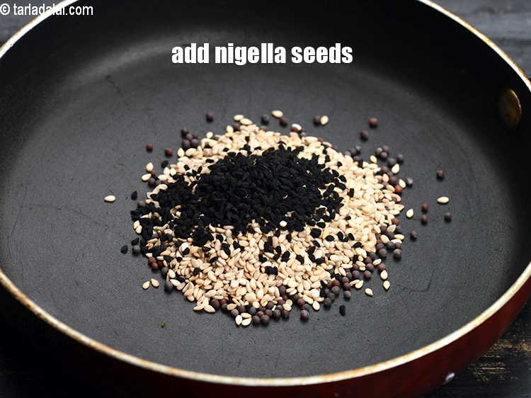 Step 12 – Add &frac12; tsp <a href="https://www.tarladalal.com/glossary-nigella-seeds-kalonji-onion-seeds-552i">nigella seeds (kalonji)</a>.