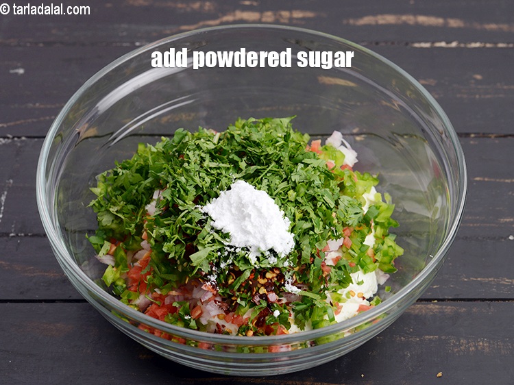 Step 11 – Add 1 tsp <a href="https://www.tarladalal.com/glossary-powdered-sugar-280i">powdered sugar</a>.