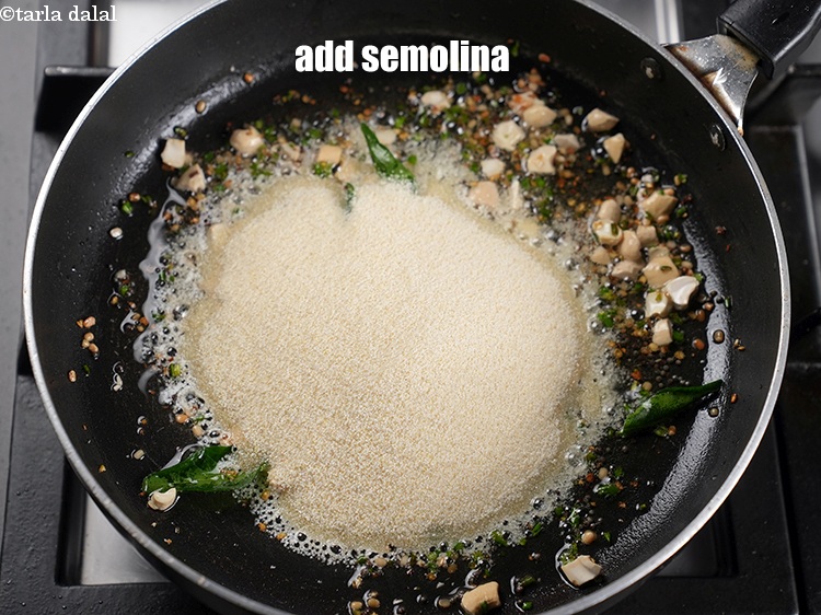Step 16 – Add &frac34; cup <a href="https://www.tarladalal.com/glossary-semolina-sooji-rava-rawa-603i">semolina (rava / sooji)</a>.