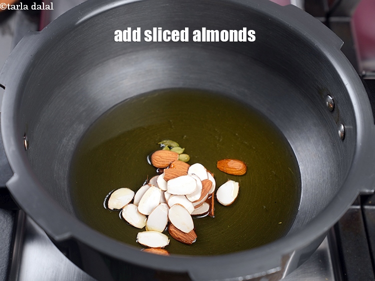 Step 11 – Add 2 tbsp <a href="https://www.tarladalal.com/glossary-sliced-almonds-2736i">sliced almonds (badam)</a>.
