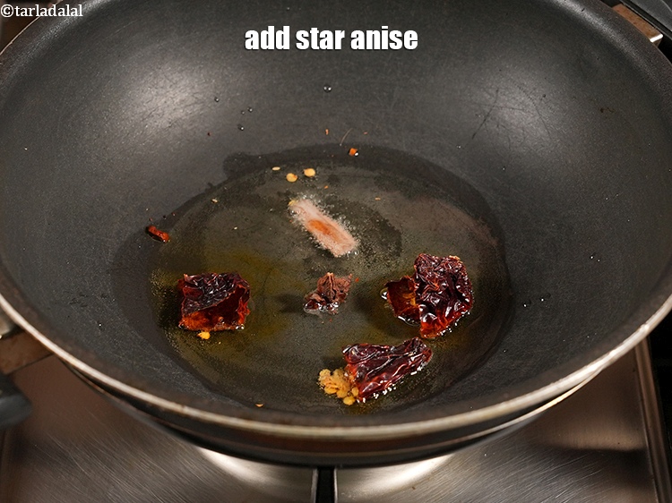 Step 11 – Add 1 <a href="https://www.tarladalal.com/glossary-star-anise-chakri-phool-623i">star anise (chakri phool)</a>.