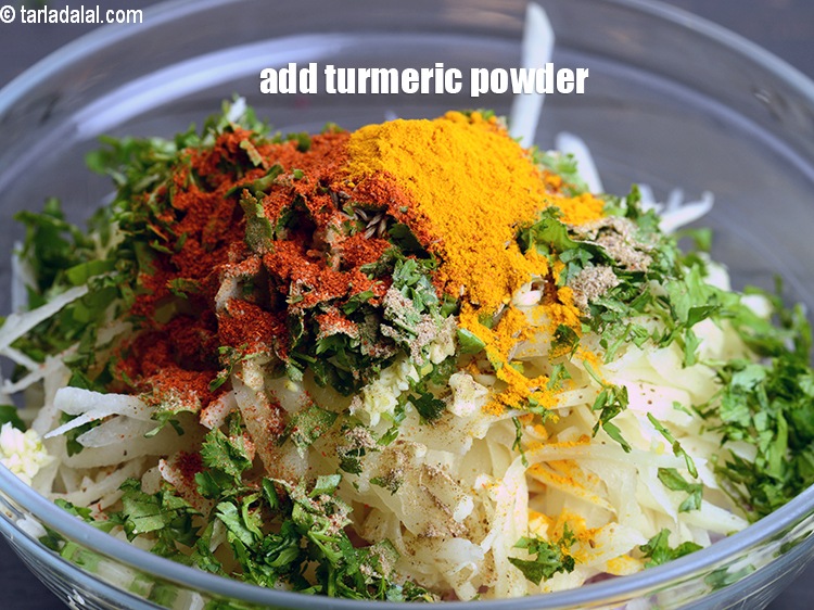 Step 11 – Add &frac12; tsp <a href="https://www.tarladalal.com/glossary-turmeric-powder-haldi-645i">turmeric powder (haldi)</a>.