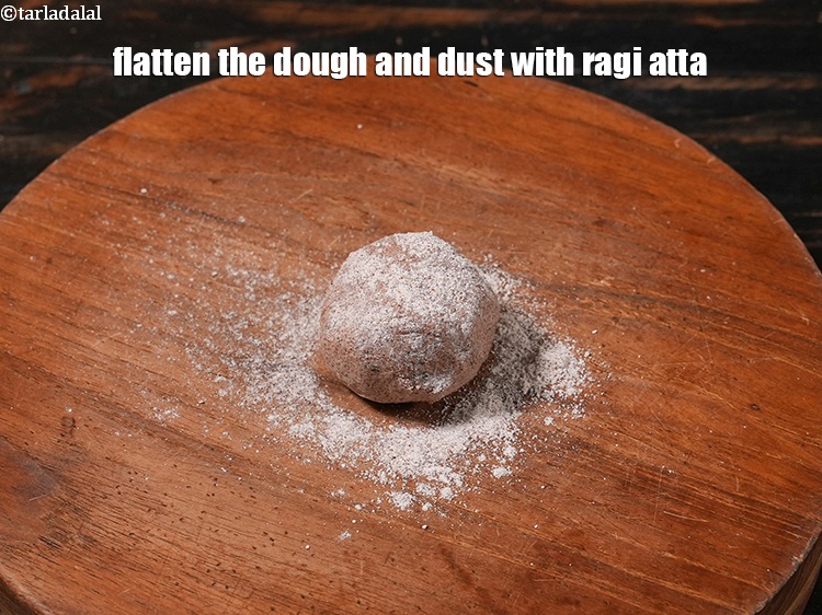 Step 13 – Flatten the dough and dust with ragi atta.