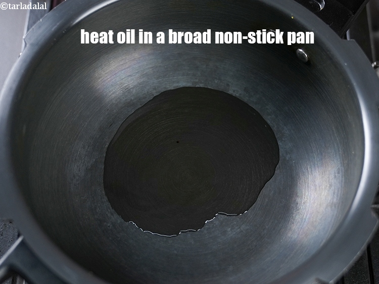 Step 11 – To make <strong>hariyali mixed sprouts dalia pulao</strong>, heat 2 tsp oil in a broad non-stick …