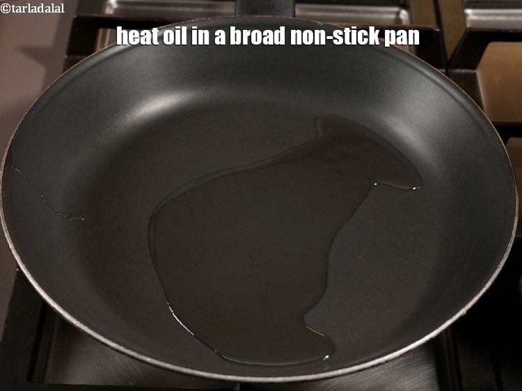 Step 11 – Heat 1 tbsp <a href="https://www.tarladalal.com/glossary-oil-671i">oil</a> in a broad non-stick pan.