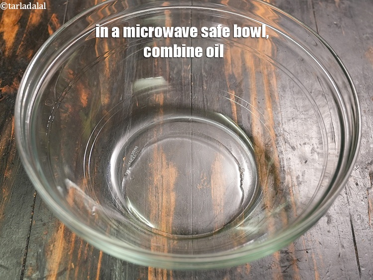 Step 11 – In a microwave safe bowl, combine 1&frac12; tbsp <a href="https://www.tarladalal.com/glossary-oil-671i">oil</a>.