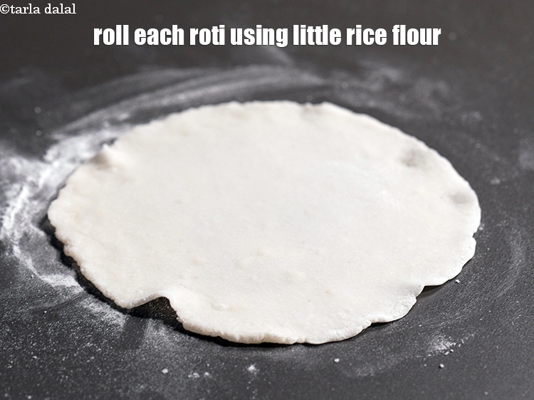 Step 11 – Divide and roll each portion of the dough into 6 inch diameter roti using little …