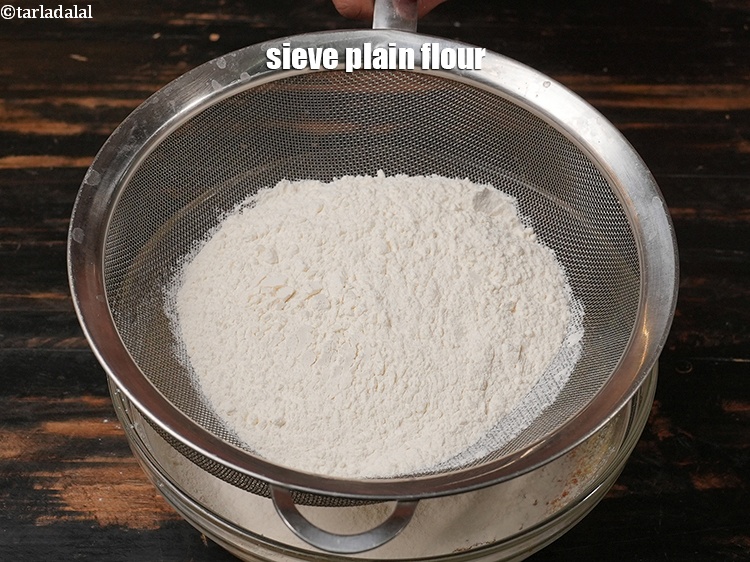 Step 11 – Sieve 1&frac12; cups of <a href="https://www.tarladalal.com/glossary-plain-flour-maida-188i">plain flour (maida)</a>.
