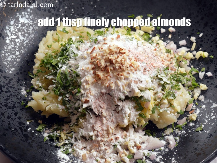 Step 11 – Add&nbsp;1 tbsp&nbsp;finely&nbsp;<a href="https://www.tarladalal.com/glossary-chopped-almonds-865i">chopped almonds (badam)</a>