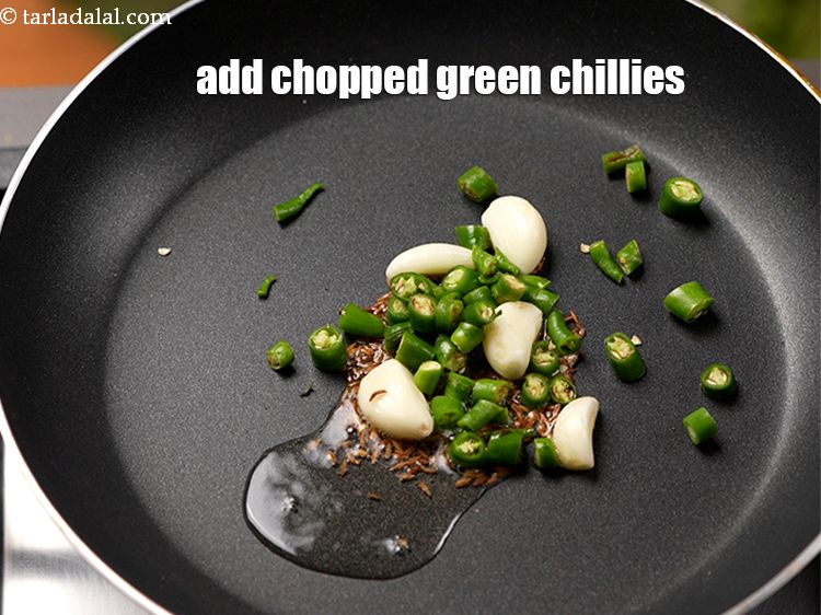 Step 11 – Add 10 <a href="https://www.tarladalal.com/glossary-chopped-green-chilli-820i">chopped green chillies</a>.