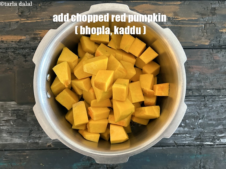 Step 11 – Add&nbsp;<meta charset="UTF-8" />4 cups&nbsp;<a href="glossary-chopped-red-pumpkin-809i">chopped red pumpkin (bhopla / kaddu)</a>.