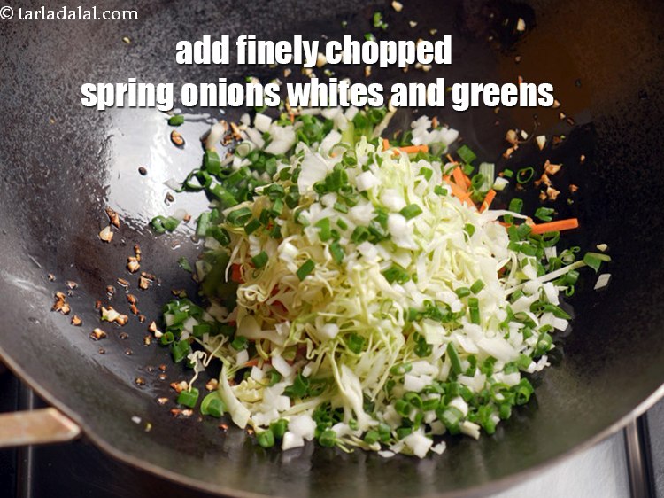 Step 11 – Add &frac14; cup finely <a href="https://www.tarladalal.com/glossary-chopped-spring-onion-whites-815i">chopped spring onions whites</a>&nbsp;and greens.