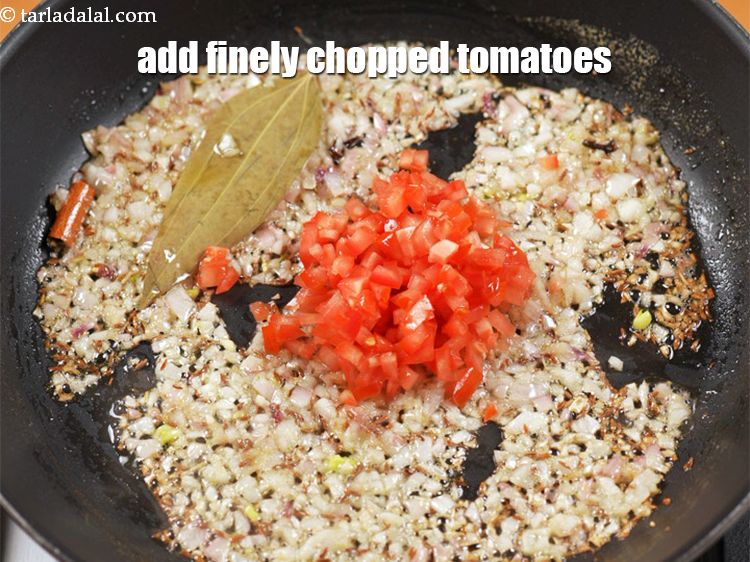 Step 11 – Add 1/4 finely <a href="https://www.tarladalal.com/glossary-chopped-tomatoes-779i">chopped tomatoes</a>.