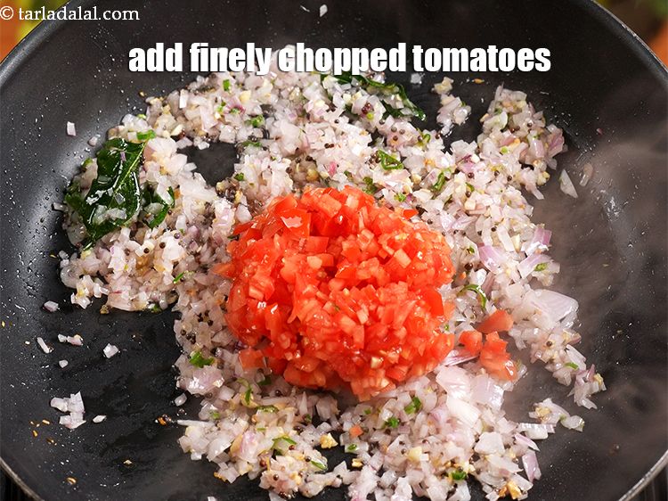 Step 11 – Add &frac12; cup finely <a href="https://www.tarladalal.com/glossary-chopped-tomatoes-779i">chopped tomatoes</a>.