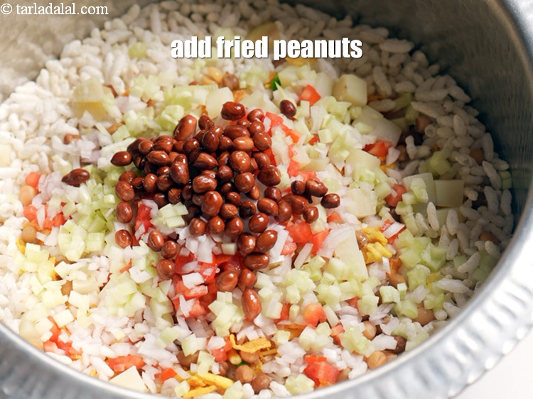 Step 12 – Add 3 tbsp <a href="https://www.tarladalal.com/glossary-fried-peanuts-fried-moongfali-1552i">fried peanuts</a>.