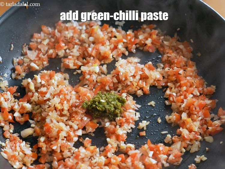 Step 11 – Add 2 tsp <a href="https://www.tarladalal.com/glossary-green-chilli-paste-hari-mirch-ki-paste-mirchi-paste-333i">green-chilli paste</a>.