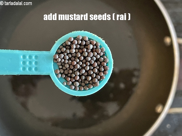 Step 24 – Add&nbsp;<meta charset="UTF-8" />1/2 tsp&nbsp;<a href="glossary-mustard-seeds-sarson-rai-sarson-ke-beej-525i">mustard seeds ( rai / sarson)</a>.