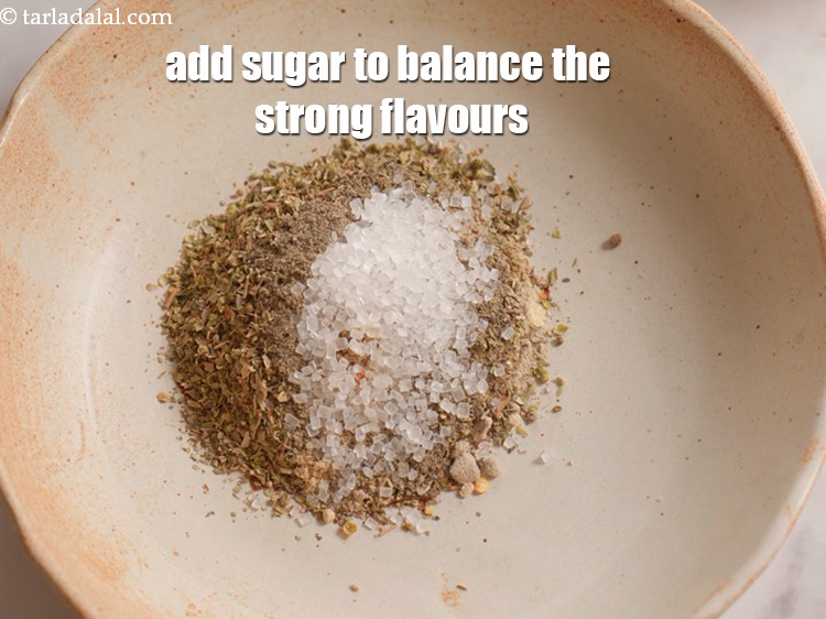 Step 11 – Add 2 tsp sugar to balance the strong flavours of the&nbsp;<strong>&nbsp;Peri Peri masala</strong>.