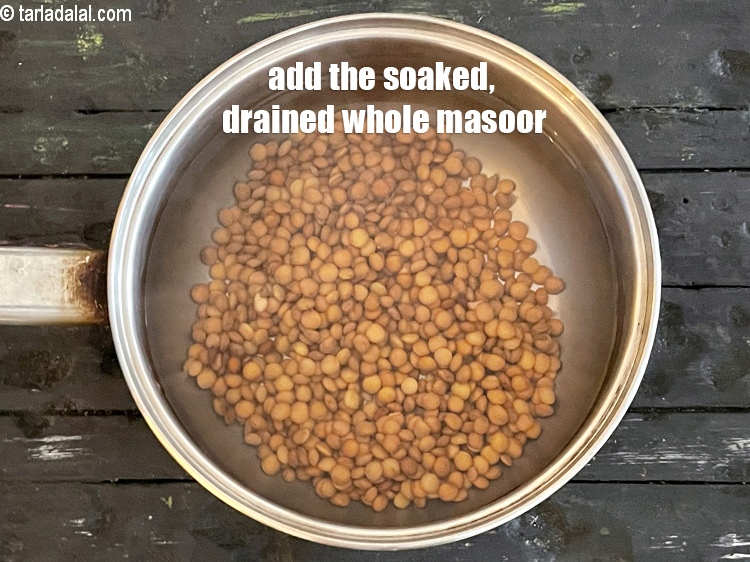 Step 12 – Put soaked whole masoor&nbsp;in boiling water.