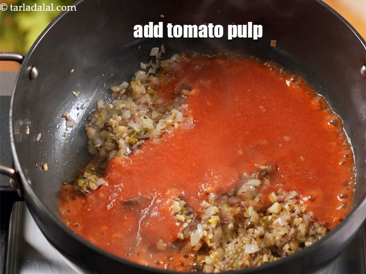 Step 11 – Add 1 cup <a href="https://www.tarladalal.com/glossary-tomato-pulp-tamatar-ka-pulp-1039i">tomato pulp</a>.
